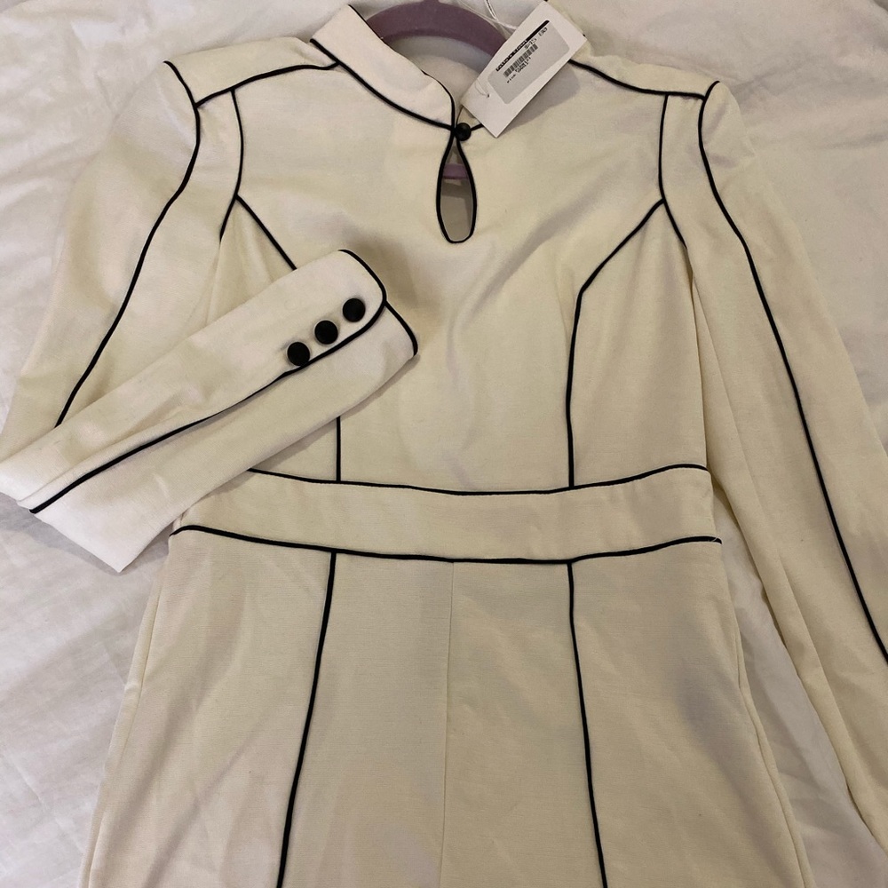 White with black piping romper